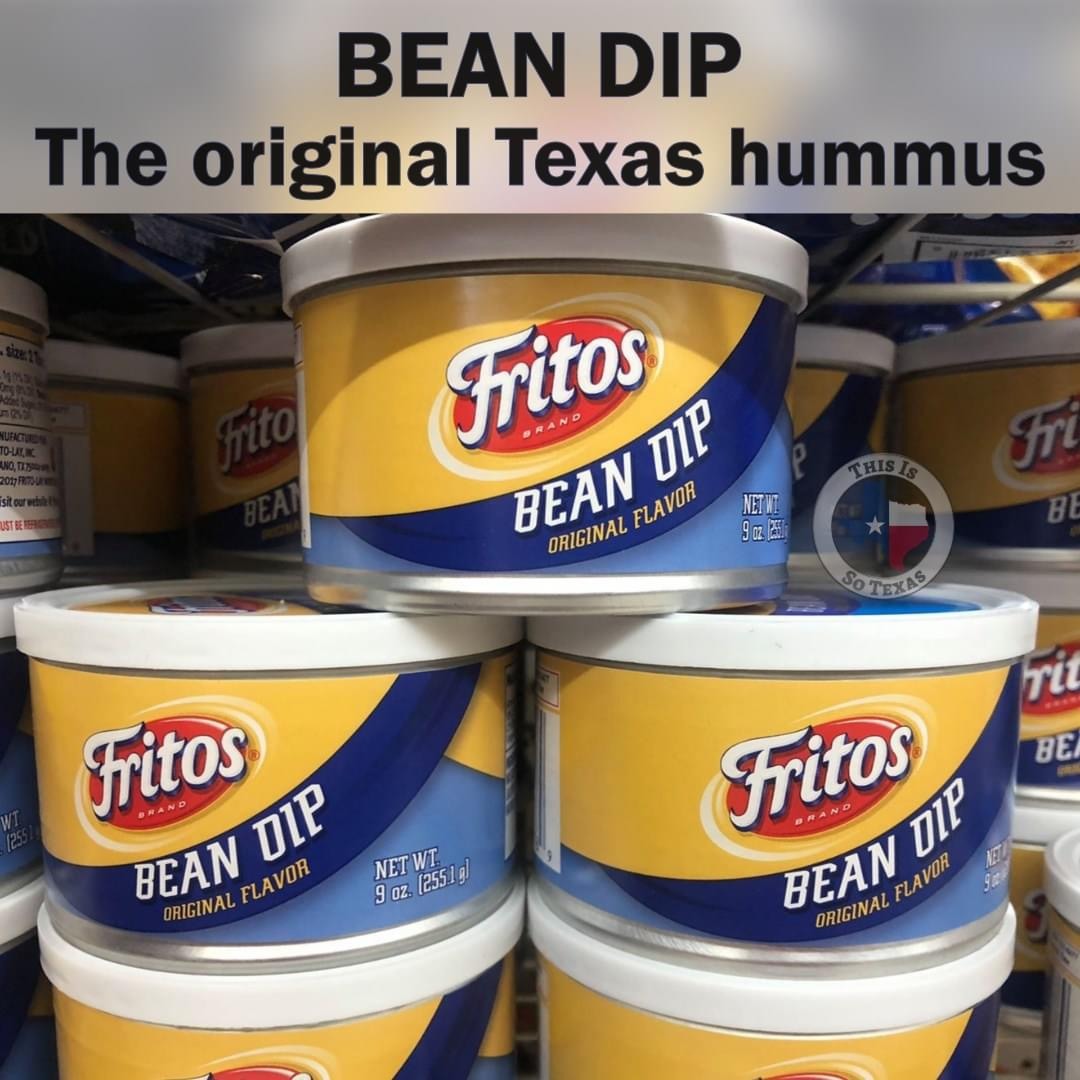 Stack of Fritos Bean Dip cans with yellow and blue labels on store shelf