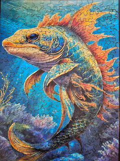 Colorful illustrated sea dragon with orange fins swimming underwater among coral