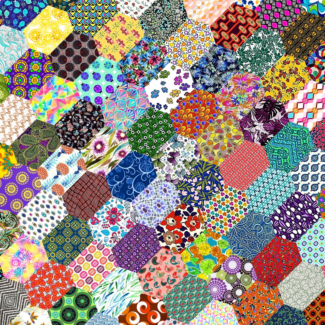 Colorful patchwork quilt with diverse patterns including flowers, dots, geometric shapes in bright varied colors