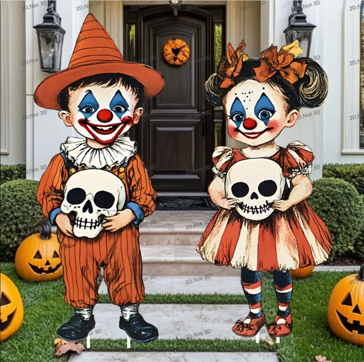 Two decorative Halloween clowns in orange and black costumes holding skulls on a decorated front porch
