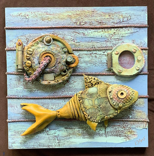 Steampunk fish wall art on distressed blue wooden planks
