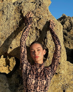 Woman Posing by Rocks