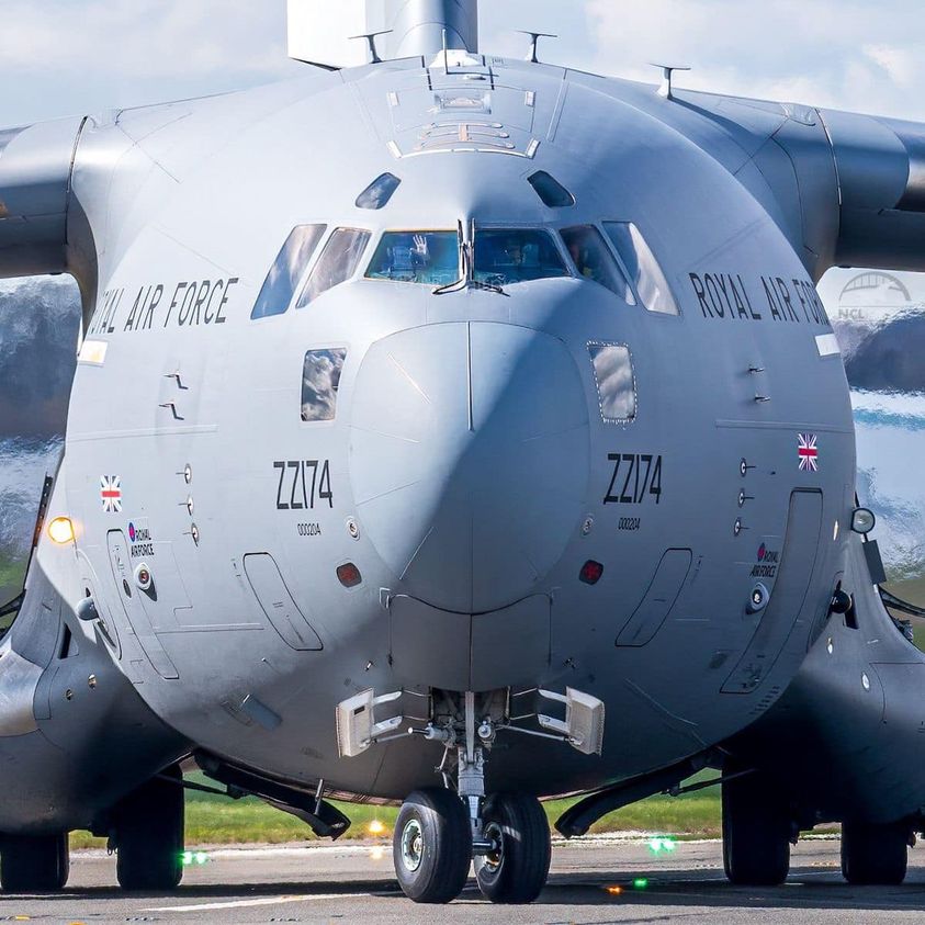 Front view of a gray Royal Air Force military transport aircraft on a runway
