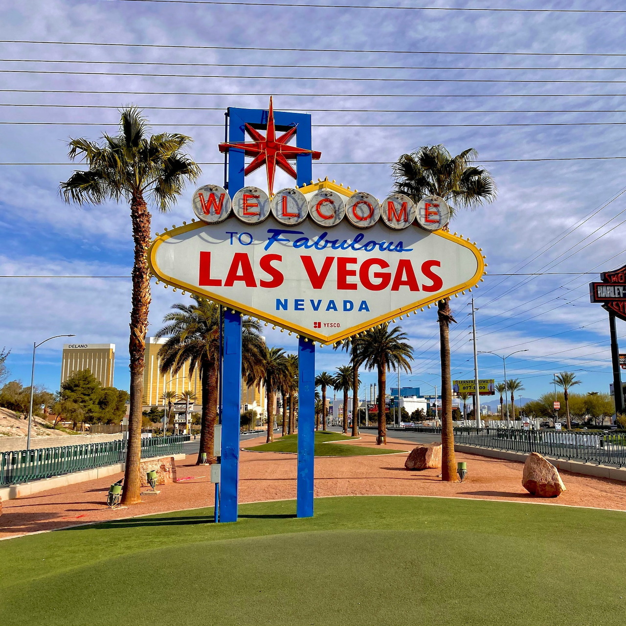 Welcome to Fabulous Las Vegas sign with palm trees and blue sky