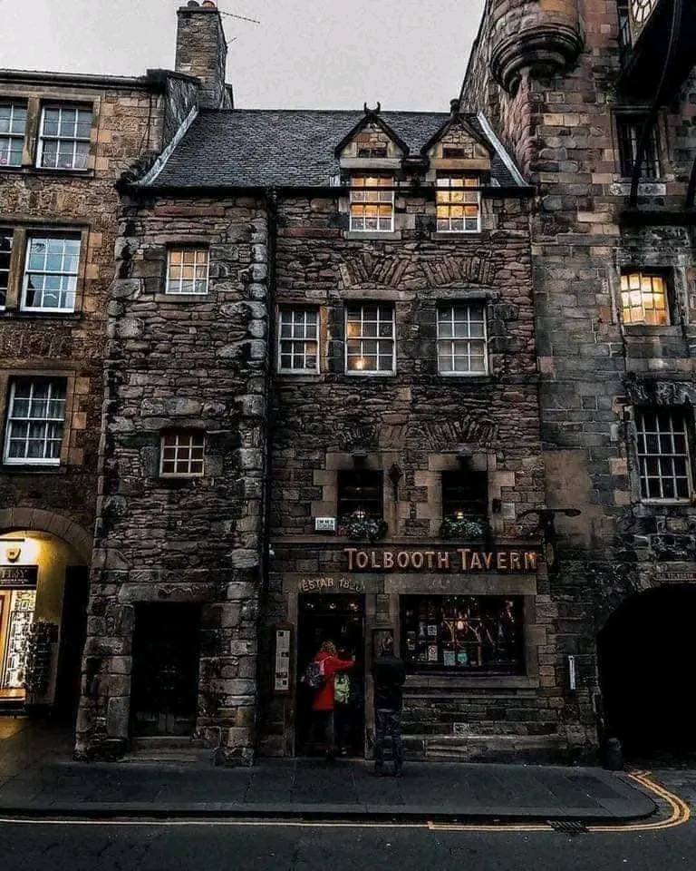 Tolbooth Tavern historic stone building with clock tower on Edinburgh's Royal Mile