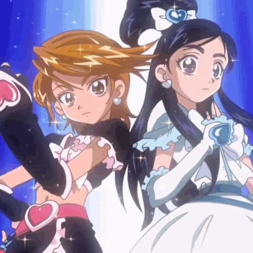 Two anime magical girls posing back to back in black and white outfits