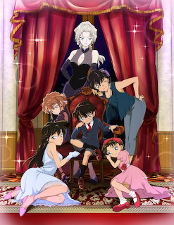 Detective Conan anime characters posed together on stage with red curtains and sparkles