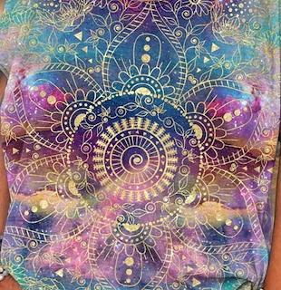 Ornate golden mandala with swirling patterns on vibrant purple and blue watercolor cosmic background