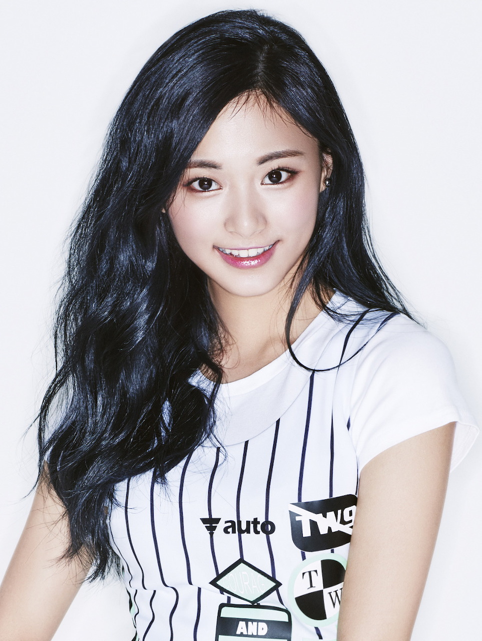 Portrait of Tzuyu from TWICE with stylish makeup and hair.