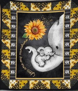 Patchwork blanket with baby elephant on moon, sunflower, and You Are My Sunshine text in yellow and gray