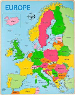 Colorful wooden puzzle map of Europe with labeled countries in bright pink, green, yellow, and orange