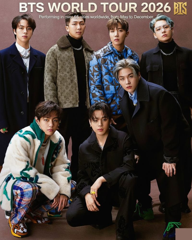 BTS group promotional photo with seven members posing in fashionable outfits under World Tour 2026 text