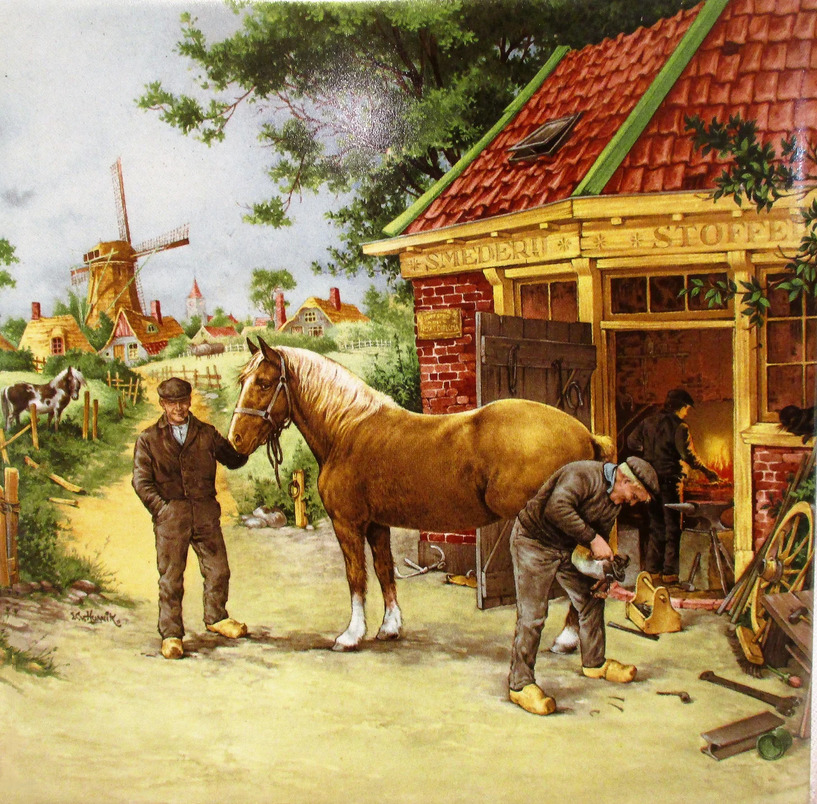 Blacksmith shoeing a brown horse outside a workshop in a Dutch village with windmill