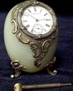 Antique Fabergé clock from 1878 with gold filigree and jeweled enamel face