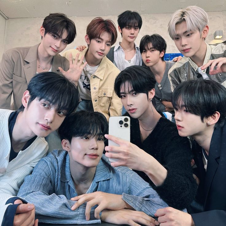 Group of young men posing together for an indoor mirror selfie