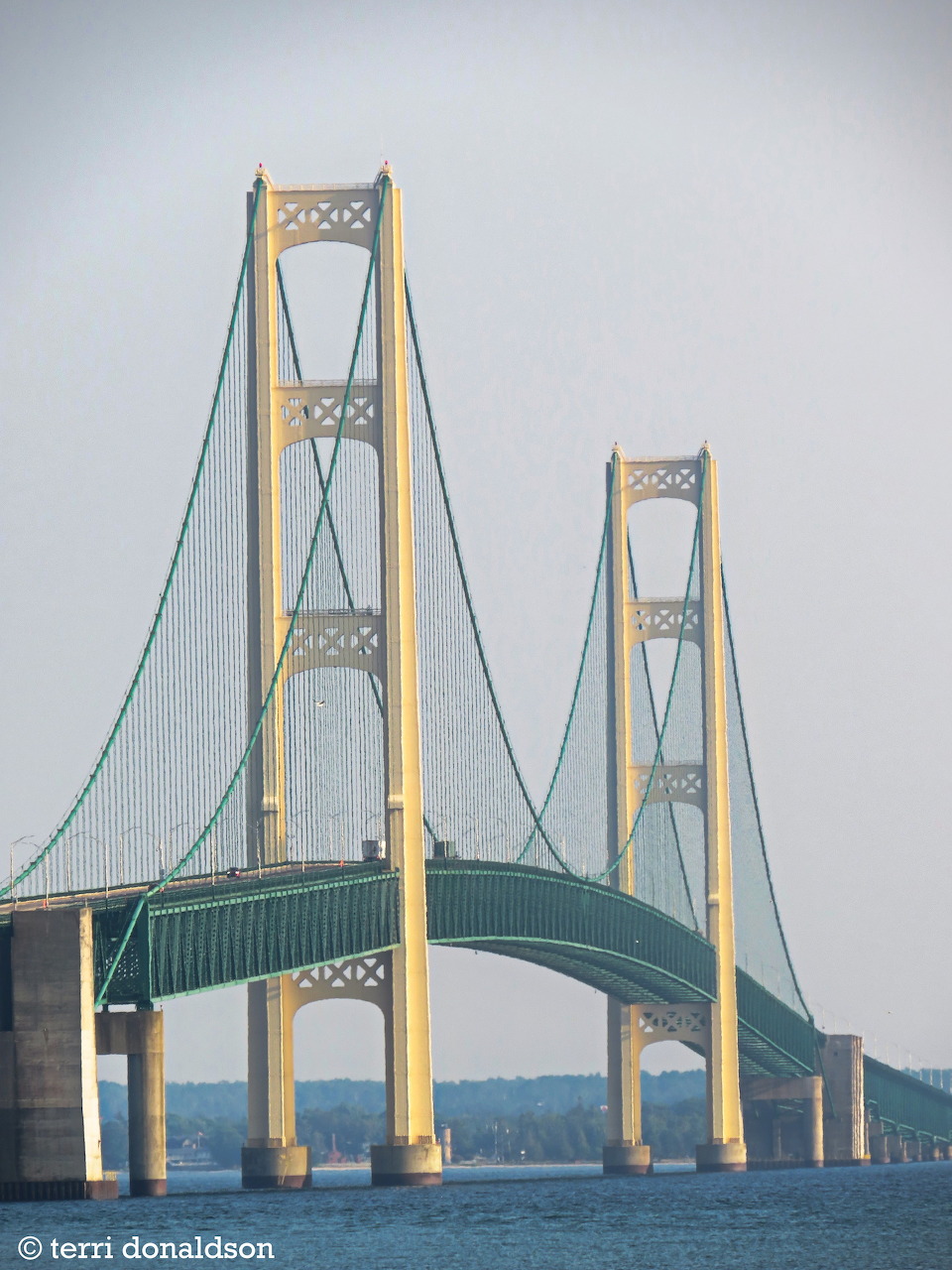 Close-up view of the Mackinac Bridge suspension towers and cables over the Straits of Mackinac, Michigan