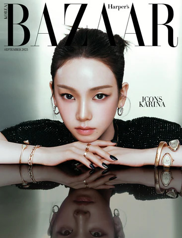 Close-up portrait of Karina resting her hands on a reflective surface on a magazine cover