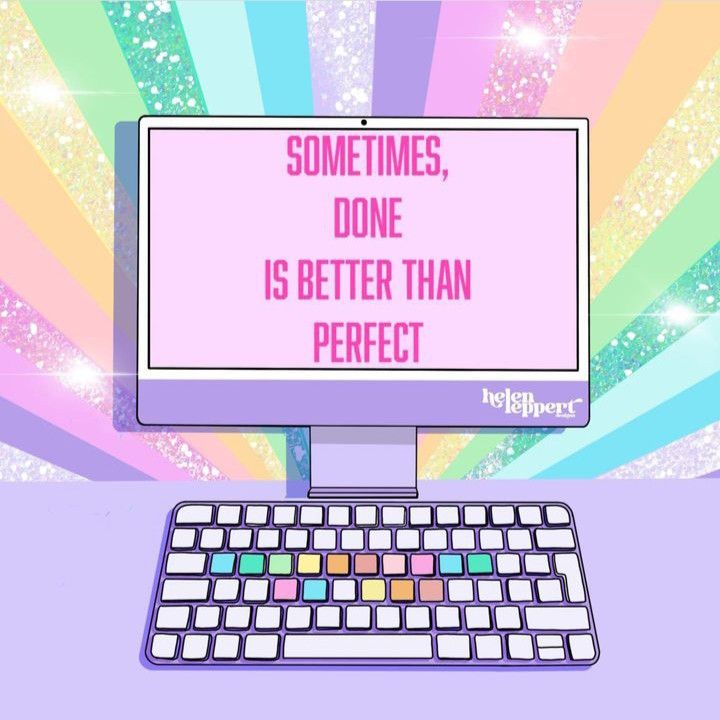 Purple computer monitor showing motivational quote on pastel rainbow sunburst background
