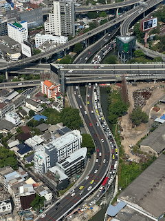 Aerial view of a busy elevated highway interchange in a dense city area