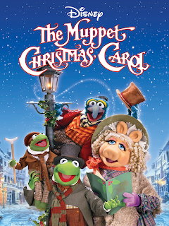 The Muppet Christmas Carol movie poster with characters in Victorian clothing on snowy street