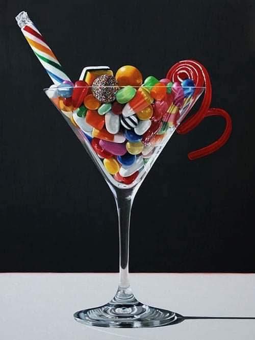Painting of a martini glass filled with colorful candies and lollipops on a dark background