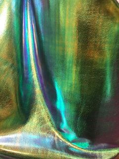 Iridescent foil with flowing green, blue, and gold metallic reflections