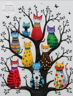 Nine colorful patterned cats sitting on black tree branches with small birds flying around them