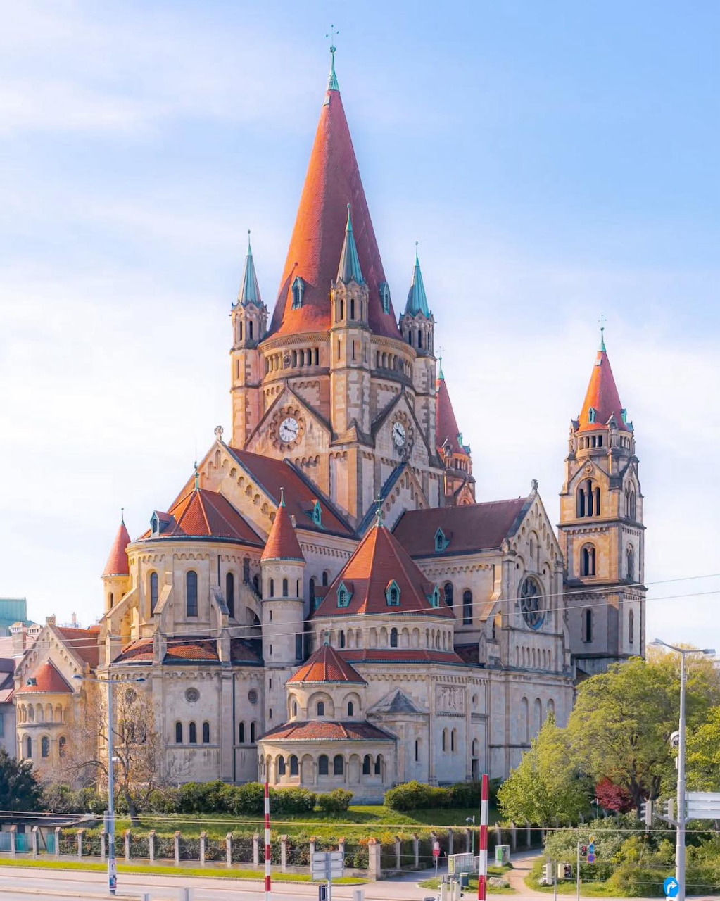 Historic church with red spires and ornate architecture in Vienna, Austria