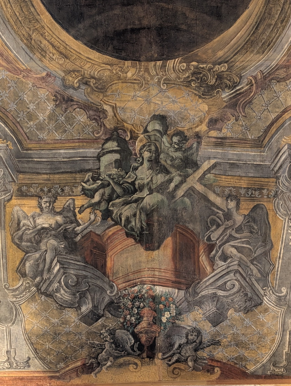 Baroque ceiling fresco with allegorical figures and angels in an ornate gilded architectural setting