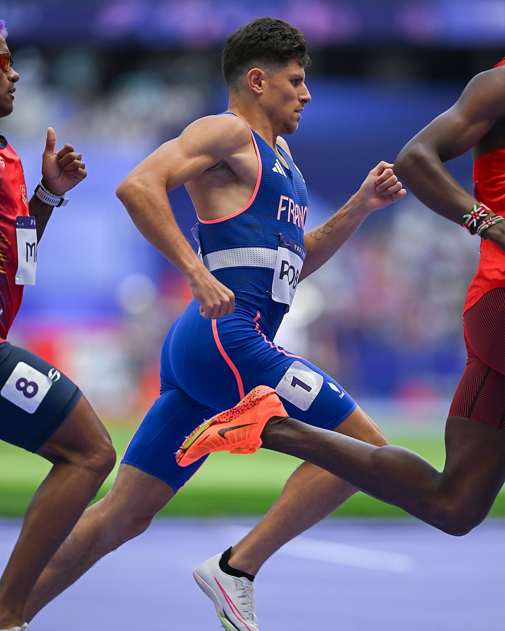 French sprinter competing in athletics race at Paris 2024 Olympic Games