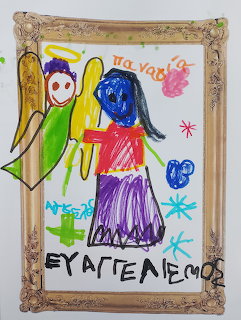 Child's crayon drawing of the Annunciation with angel and Mary in a gold ornate frame