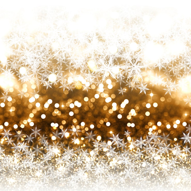 Golden bokeh lights with white snowflakes on a festive Christmas background