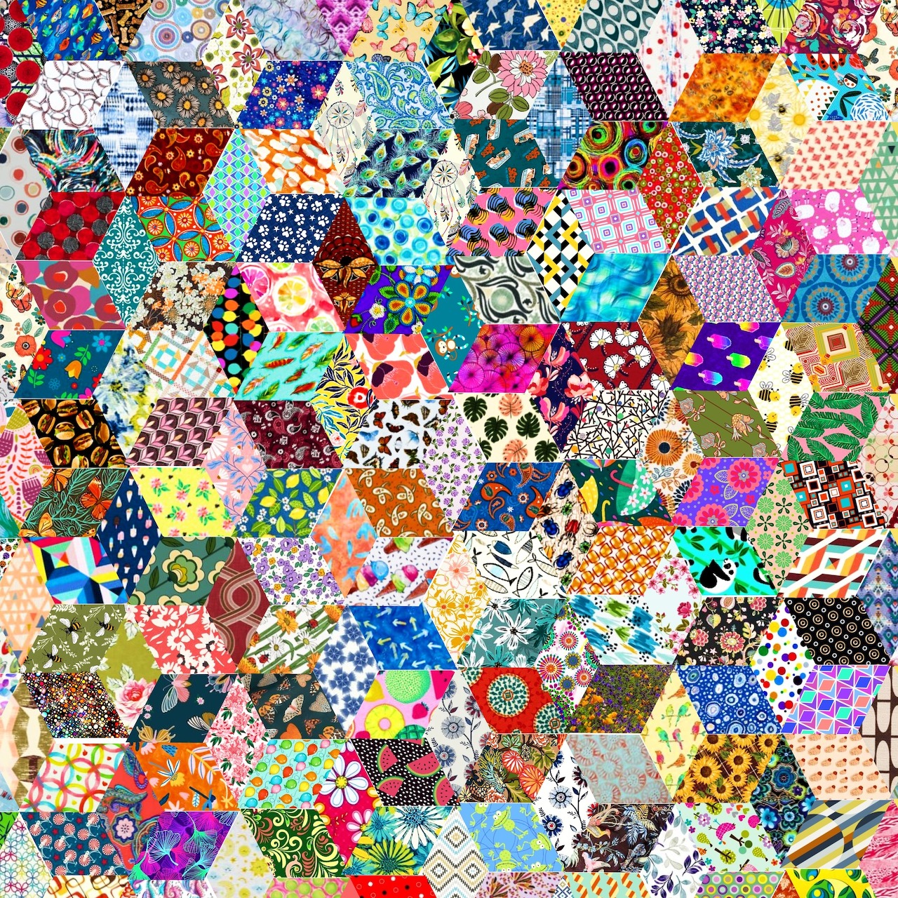 Dense mosaic of colorful hexagonal fabric patches with various patterns including florals, geometrics, and polka dots