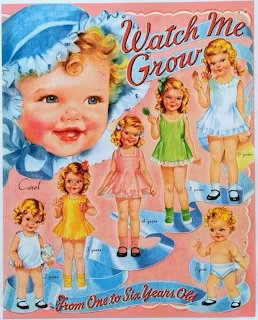 Vintage illustrated paper doll cover with baby portrait and six little girl dolls in pastel clothes