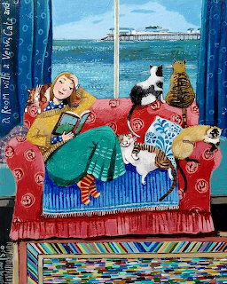 Woman on red couch reading with black-white cat and tabby cat by window overlooking pier