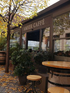 Storefront exterior of Amber Caffé with signage and entrance
