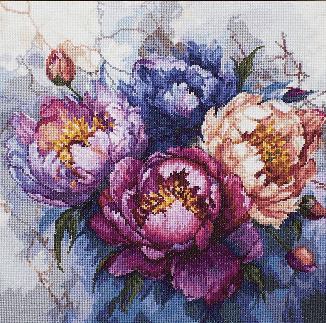 Cross-stitch embroidery of colorful peony flowers in pink, purple and blue tones on white fabric