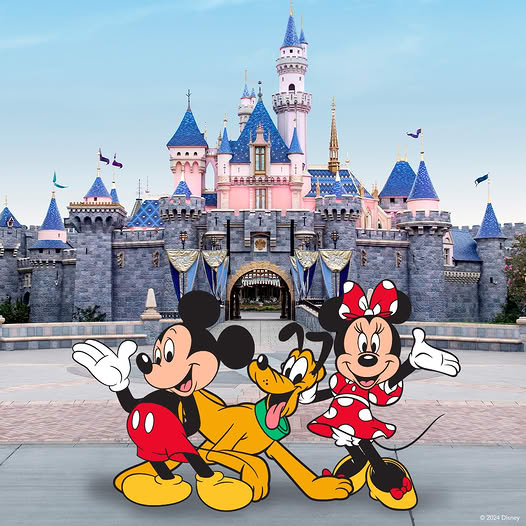Mickey Mouse, Minnie Mouse and Pluto in front of Disneyland castle