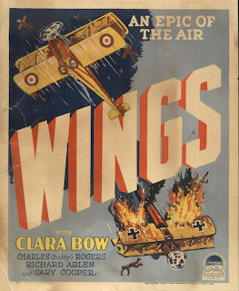 Vintage Wings 1927 film poster showing biplane and combat scene with large title text