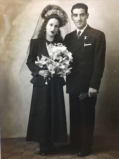 Vintage black-and-white wedding portrait of a bride and groom standing together
