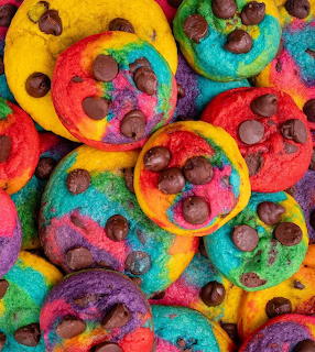 Overhead view of colorful rainbow chocolate chip cookies with various bright hues