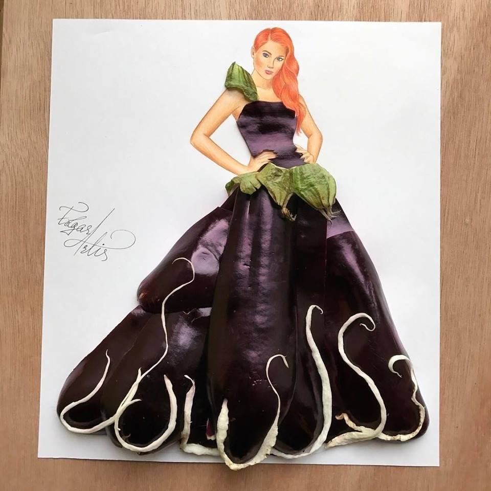 Fashion illustration of a woman in a dark purple gown with green accents on white paper