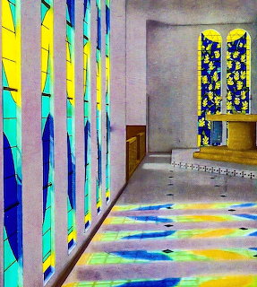 Chapel interior with stained glass windows and colorful light reflections on the floor