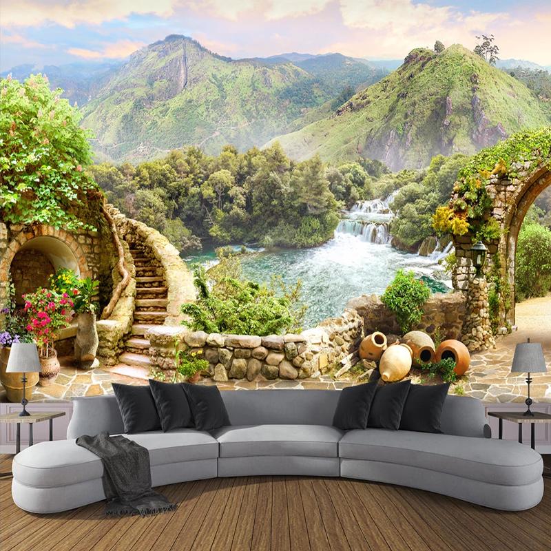 Modern living room with a curved gray sofa and a scenic mountain lake mural on the wall