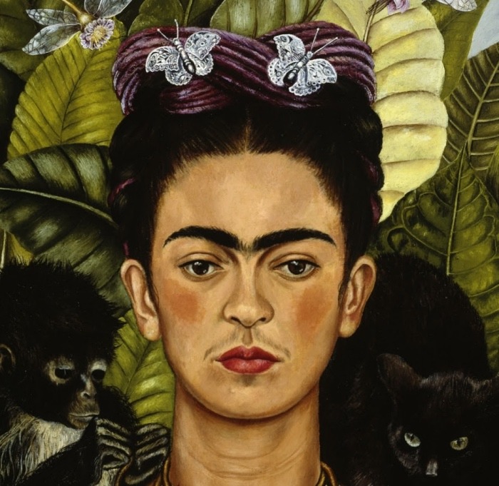 Frida Kahlo self-portrait painting with butterflies, monkeys, and large tropical leaves