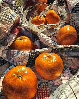 Watercolor painting of bright oranges with seashells on patterned fabric