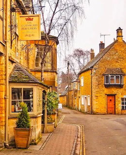 Traditional Cotswold stone buildings along a village street in Bourton-on-the-Water, England