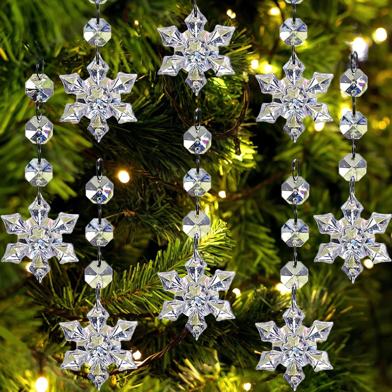 Crystal snowflake ornaments hanging on a lit Christmas tree
