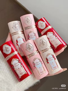 Seven Flower Knows blush tubes in pink and red ornate packaging arranged together