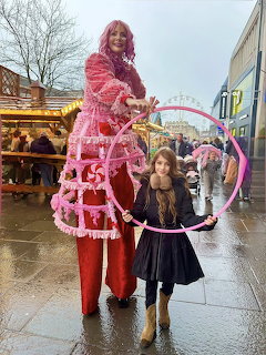 Pink Stilt Walker with Child